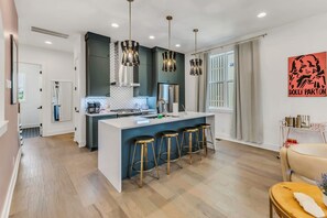 Experience this stylish Nashville oasis where modern elegance meets local charm. With an open-concept kitchen and sleek bar, it's perfect for gatherings, bachelorette parties, or family reunions—offering unforgettable memories in downtown living!