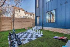 Enjoy your private outdoor oasis with a giant chessboard, perfect for sunny Nashville games! This stylish vacation rental is ideal for large groups, blending modern design with fun amenities in Music City. Experience luxury for your next bachelorette party or family reunion!