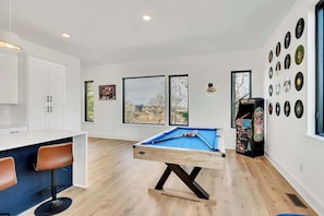Welcome to your chic Downtown Nashville retreat! Enjoy game nights with city views in a vibrant game room. Perfect for large groups, this stylish haven is ideal for bachelorette parties or family reunions. Create unforgettable memories with skyline views in your plush accommodations!
