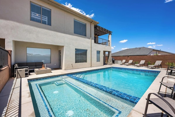 Unwind in your private heated pool & hot tub with lounges eating & fire pit