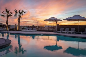 Sunset paints the sky as the lazy river shimmers in the evening glow