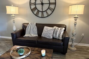 This couch pulls out to a Queen mattress allowing for 2 more people to sleep comfortably!
