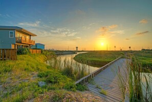 The boardwalk outside the home takes you directly to the beach. Golf carts are allowed.