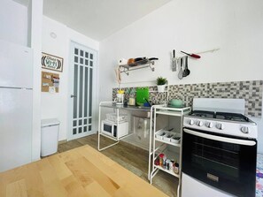FULL KITCHEN WITH STOVE, PANS , CUTLERY, UTENSILS, MICROWAVE TRASHCAN
