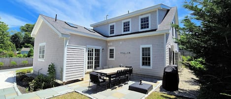 Wonderful back deck with large dining table, gas grill and enclosed outdoor shower