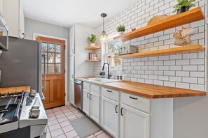 Open shelving in kitchen with colorful accents