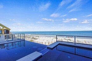 Heated hot tub and heated infinity pool overlooking the Gulf