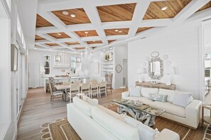 Coastal chic living room with comfy sofas & framed art