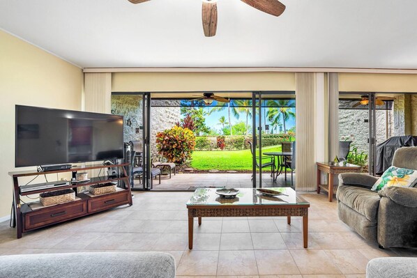 Living room with flat screen TV and lanai access