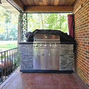 The gourmet grill is just steps away from the side door to the kitchen. 