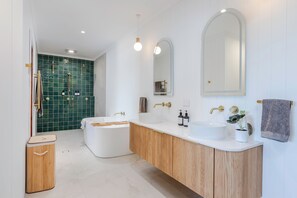 Master Ensuite - double shower, bath, sauna, walk-in-robe with pool & lake view (1)