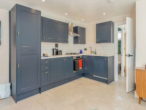 Open plan living space | Woodcutter Cabin - Beechlawn Holidays, Leatherhead