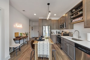 From the living room, you can see the kitchen, dining area and main entrance.