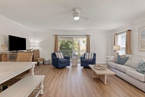 Open living room with access to the back porch