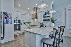 Kitchen: Keurig, drip coffee maker, cooking utensils, toaster, blender tableware, main floor