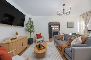 Step into our cozy living room, the perfect spot to relax and unwind.