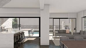 Large kitchen and living room with large smart TV, sound system and cozy sofas.