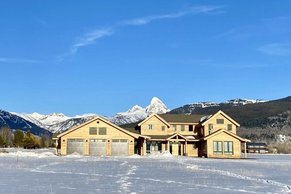 With a chic mountain-modern design to complement useful amenities, such as a spacious three-car garage, this home has plenty to offer any group.