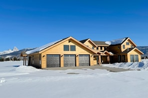 With a chic mountain-modern design to complement useful amenities, such as a spacious three-car garage, this home has plenty to offer any group.