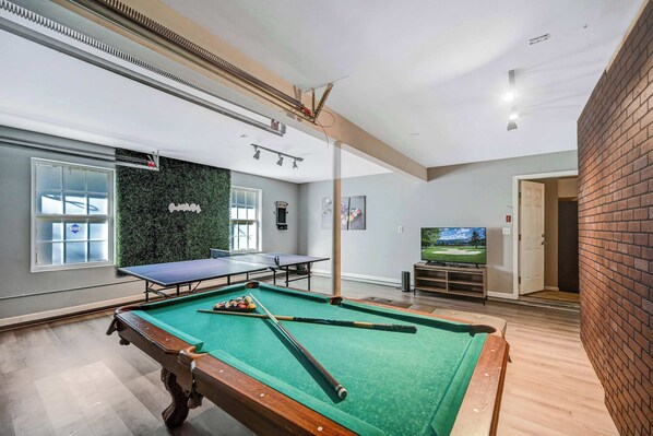 The Ultimate Hangout Spot! Pool table, ping-pong, and a cozy TV setup, perfect for family and friends to enjoy together.
