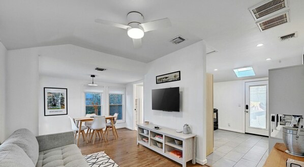 Warning: May cause extreme relaxation. This cozy living room + huge TV = Netflix heaven!