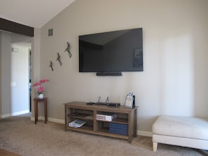 Flat-screen smart TV with sound bar