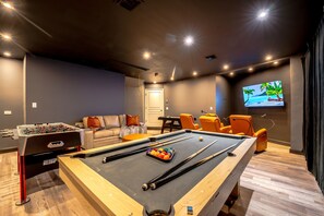 Challenge friends to pool, foosball, or air hockey, then relax in the indoor cinema or on plush sofas. Entertainment galore!