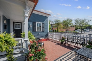 Charming front porch courtyard.