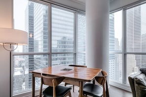 Gather around for meals or moments in a warm and inviting dining space.