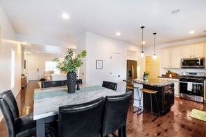 Spacious kitchen with oversized island, large dining room seats 6.