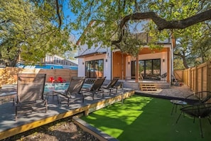 Escape the hustle and bustle in our backyard paradise, where the pool beckons you to relax.