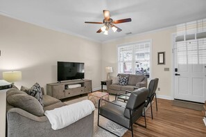 Sit back, relax, or socialize in the cozy living room, located next to the front door for easy access and friendly entertainment. Free cable through YouTube TV included in your stay!
