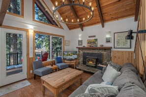 Cozy woodstove in the living area with TV with streaming