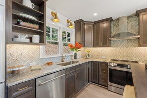 Ample kitchen space with stainless steel appliances 