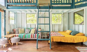 queen bed and ladder to loft with 2 other beds