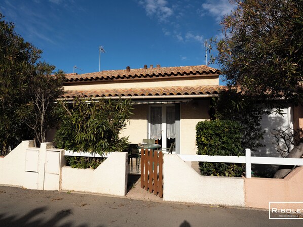 House with terrace in front. 