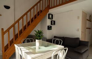 Air-conditioned living room with fully equipped kitchen