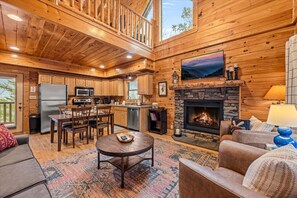 Relax in the elegant living area, featuring a Smart TV and a cozy fireplace—the perfect spot to unwind after a day of exploring!