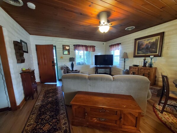 Living room view from built-in desk/dining area