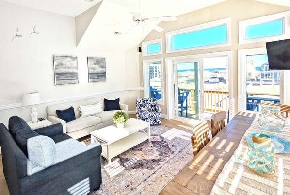 Bright coastal retreat with stunning views, steps to the beach and sunny deck!
