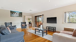 Stylish living area featuring a flat-screen TV for entertainment.