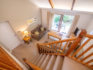 Open plan living space with mezzanine floor