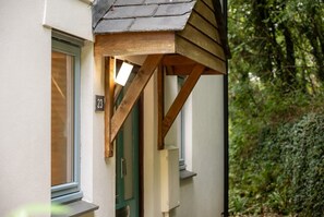Beacon front door and woodland surroundings