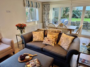 Seating area with doors leading to the garden