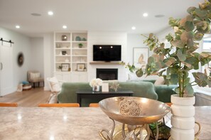 Living room with Smart TV and gas fireplace.