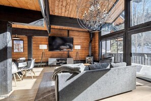 Living room with wood burning fire place. Stocked with games! 