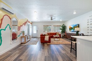 Open-concept layout, perfect for group hangs. Shown: entrance into unit