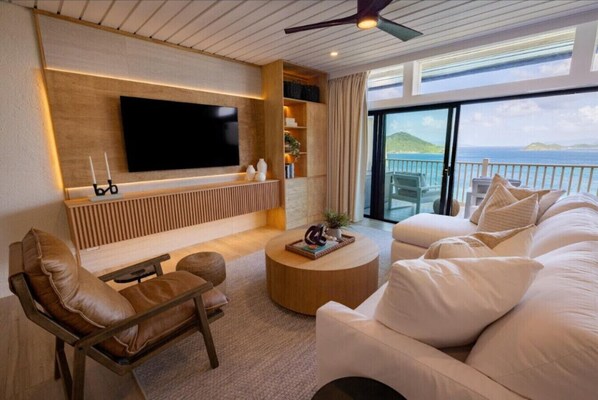 Living room with sea and mountain views