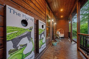 Outdoor Lounge: Enjoy fun games and relaxing vibes on the spacious deck surrounded by nature!