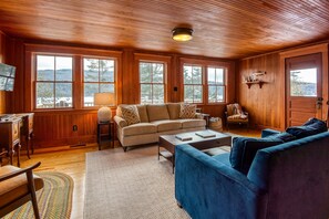 Cozy living room with beautiful views of Rangeley Lake!